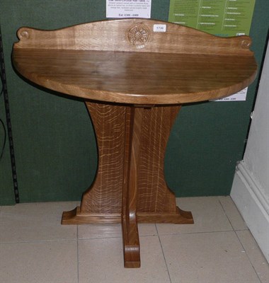 Lot 1730 - An Old Mill Furniture English Oak Semi-Circular Hall Table, the shaped upstand carved with a...