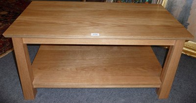 Lot 1733 - An Arts and Crafts Style Treske Furniture English Oak Rectangular Coffee Table, with magazine...