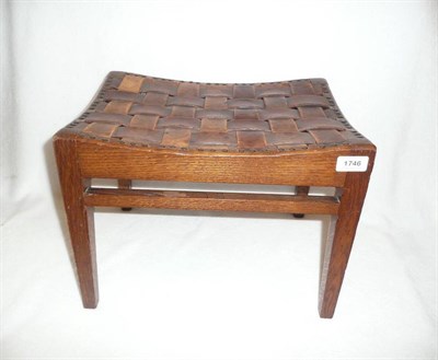 Lot 1746 - An Arthur W Simpson Oak Stool, with interwoven leather seat, on four tapering square section...