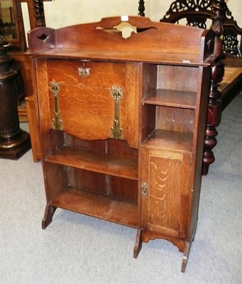 Lot 1747 - A Liberty & Co Oak Bureau Bookcase, with pierced upstand, the fall front enclosing fitted interior