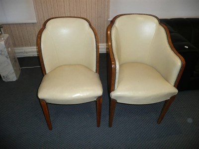 Lot 1752 - A Set of Six Art Deco Walnut Cloud Back Dining Chairs, upholstered in cream leather, on tapered...