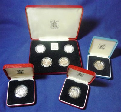 Lot 244 - 7 x Silver Proof £1 Coins - 3 x 1983, individually cased and a set of four in a RM Silver...