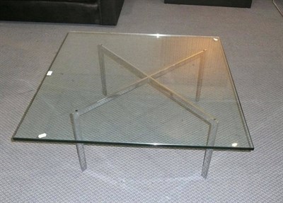 Lot 1764 - A Knoll Barcelona Table, the square glass top, 2cm thick on a chrome cross frame of square section