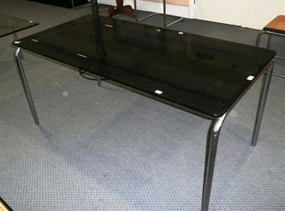 Lot 1765 - A Modern Smokey Glass and Chrome Table, on a tubular frame, probably Cassina, unmarked, 150cm...