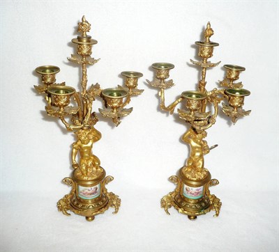 Lot 1202A - A Pair of French Ormolu and Porcelain Mounted Four-Branch Five-Light Table Candelabra, circa...