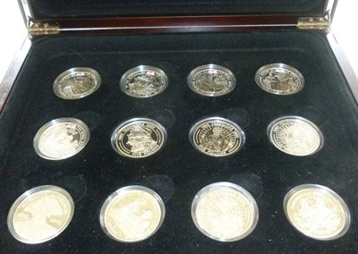 Lot 82 - A Collection of 12 x Silver Crowns comprising: 5 x £5 'History of the Royal Navy'  Guernsey...