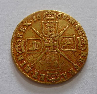 Lot 131 - Charles II Guinea 1669, a detector find with numerous surface marks, digs and scratches  and...