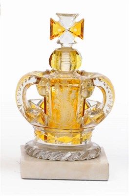 Lot 11 - An Amber Flash and Cut Glass Openwork Crown Scent Bottle, perhaps circa 1837, with central lift-out