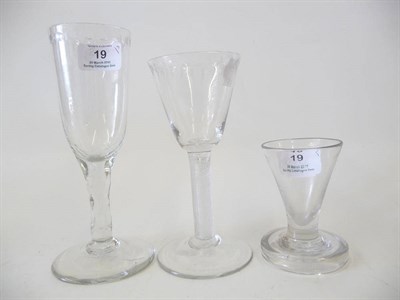 Lot 19 - A Wine Glass, circa 1750, the round funnel bowl engraved with a formal band below the rim, multiple