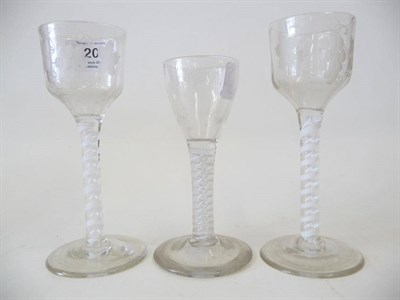 Lot 20 - A Pair of Wine Glasses, circa 1770, the ogee bowls engraved with a bunch of grapes and a star,...