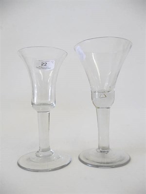 Lot 22 - A Wine Glass, circa 1740, the bell bowl with tear in the solid base, plain stem, 18cm high; and...