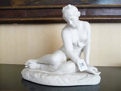 Lot 65 - The Reclining Venus, unknown factory, circa 1870, holding a shell in her left hand and gazing...