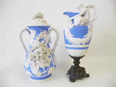 Lot 69 - A Blue Tinted Parian Classical Ewer, unknown factory, circa 1860, modelled as a merman...