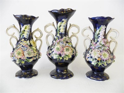 Lot 84 - A Garniture of Three Coalport Encrusted Floral Porcelain Vases, circa 1840, each of baluster...