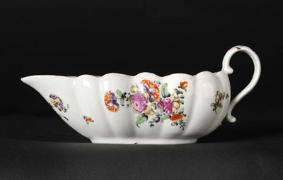 Lot 115 - A Derby Shallow Fluted Sauce Boat, circa 1760, enamelled with scattered small flower sprays and...