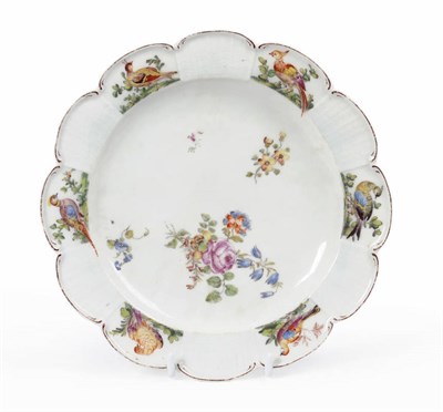 Lot 136 - A Chelsea Plate, circa 1758, of scalloped circular form, the border panels painted with birds...