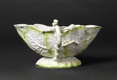 Lot 142 - A Longton Hall Cabbage Leaf Sauceboat, circa 1755, with double branch moulded handles, the interior