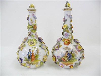 Lot 149 - A Pair of Dresden Flower Encrusted Porcelain Bottle Vases, circa 1900, each painted with a...