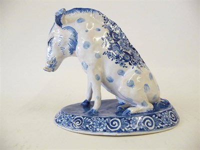 Lot 151 - A Dutch Blue and White Delft Pottery Model of a Boar, circa 1900, seated on its haunches, a...