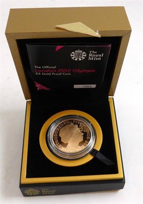 Lot 50 - London 2012 Olympics Official Gold Proof £5, rev. London skyline in centre with outer circle...