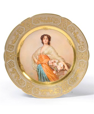 Lot 173 - A German "Vienna" Porcelain Cabinet Plate "The Flower Seller", circa 1900, shaped circular, the...