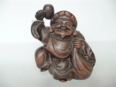 Lot 188 - A Japanese Bizen Pottery Figure of Daikoku, circa 1880-1900, the jovial deity carrying a large sack