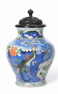 Lot 194 - A Chinese Famille Verte Baluster Vase, circa 1880, painted on each side with a similar scene of...