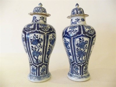 Lot 217 - A Pair of Chinese Blue and White Export Porcelain Baluster Vases and Covers, Kangxi...