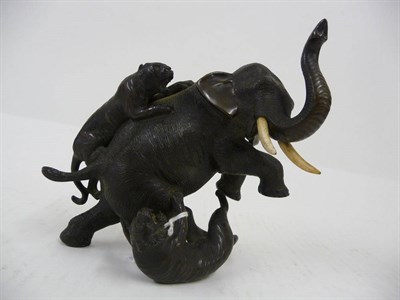 Lot 221 - A Japanese Bronze Elephant and Tiger Group, late Meiji period (1868-1912), the rearing bull...