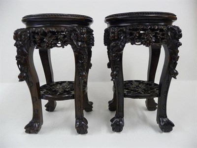 Lot 227 - A Pair of Late 19th Century Chinese Hardwood Table Top Urn Stands, each with circular marble...