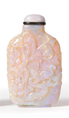 Lot 233 - A Chinese Carved Opal Snuff Bottle, 20th century, of spade form, carved in high relief with a...