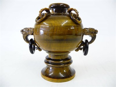 Lot 238 - A Chinese Carved Tiger's Eye Archaic Form Pedestal Cup and Cover, 20th century, the circular...