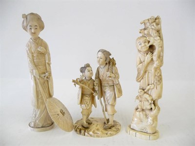 Lot 239 - A Japanese Carved Ivory Figure Group, late Meiji period (1868-1912), as a peasant and her...