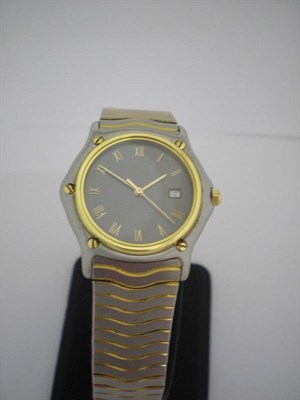 Lot 270 - A Stainless Steel Calendar Centre Seconds Quartz Wristwatch, signed Ebel, circa 2005, quartz...