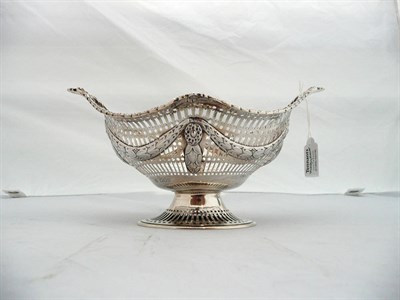 Lot 337 - A Victorian Basket, Charles Stuart Harris, London 1896, shaped oval with chased foliate swags...