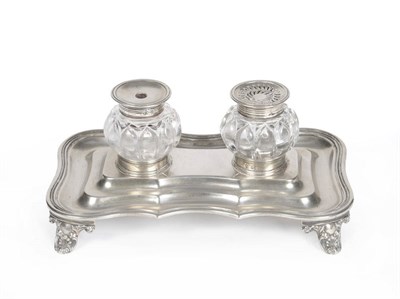 Lot 357 - A William IV Inkstand, Joseph & John Angell, London 1832, shaped rectangular on four cast anthemion