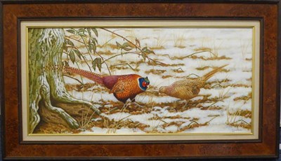 Lot 2168 - Robert E Fuller (b.1972) A cock and hen pheasant in the snow Signed and dated 1998, oil on...