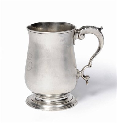 Lot 377 - A George III Mug, Hester Bateman, London 1788, of plain baluster form with leaf capped scroll...