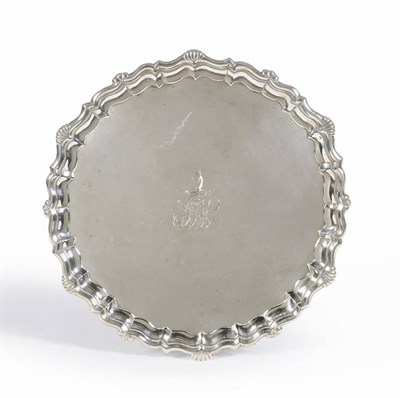 Lot 390 - A George II Salver, Dennis Wilks, London 1744, shaped circular with shell and scroll rim, raised on