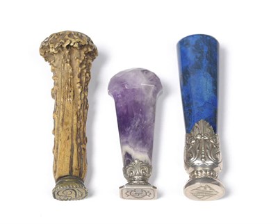 Lot 408 - An Amethyst-Handled Hand Seal, 19th century, with faceted swollen head and panelled tapered...