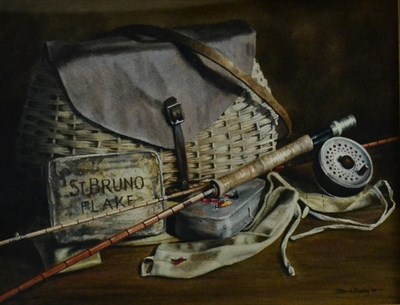 Lot 2066 - John A Blakey (b.1952)  Still life of fishing rod, a tin of tobacco and a fly fishing basket...