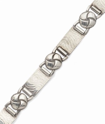 Lot 425 - An Arts and Crafts White Metal Bracelet, by Kollmar & Jourdan, hammered knot links alternate...