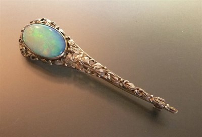 Lot 428 - An Art Nouveau Pin Brooch, possibly Rhoda Wager, a large cabochon opal composite sits within a...