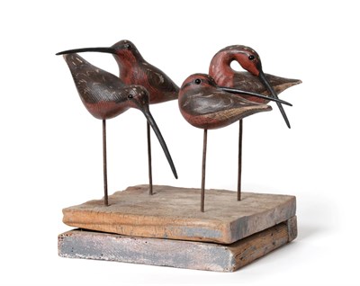 Lot 2194 - Guy Taplin (b.1939)  Four sanderlings Each signed, carved and painted wood, raised on a wooden...