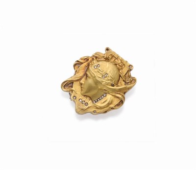 Lot 435 - An Art Nouveau Style Brooch, in the form of a maiden's head with flowing locks, within a...