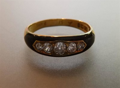 Lot 438 - An 18 Carat Gold Victorian Diamond Set Mourning Ring, the five graduated old cut diamonds in a...