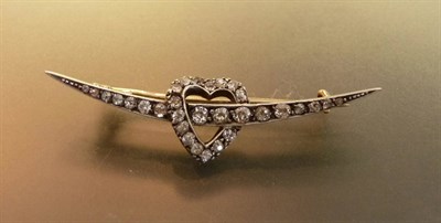 Lot 439 - A Victorian Diamond Brooch, in the form of a heart over a crescent, set with graduated old...