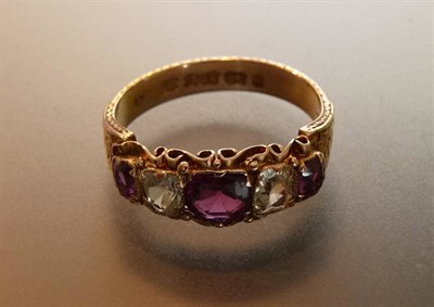 Lot 443 - A Victorian 15 Carat Gold Garnet and Chrysoberyl Five Stone Ring, the stones in claw settings...