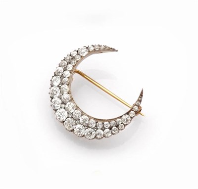 Lot 445 - A Victorian Diamond Crescent Brooch, two rows of graduated old cut diamonds are spaced by tiny...