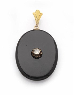 Lot 447 - A Victorian Onyx and Diamond Locket Pendant, the large oval onyx suspended from a textured...